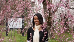 Surrounded by a dark pink cherry blossom